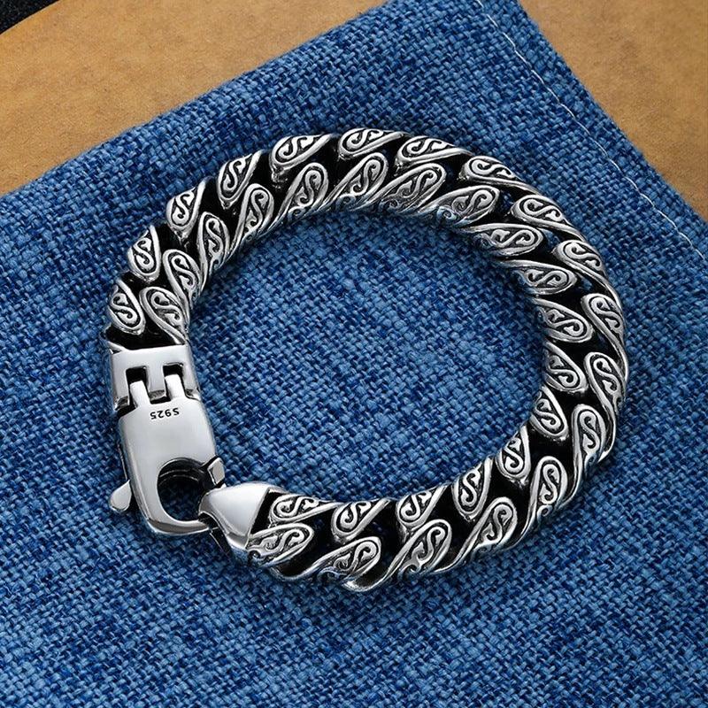Close-up of the sterling silver bracelet’s delicate engravings, showcasing detailed craftsmanship and luxurious appeal.